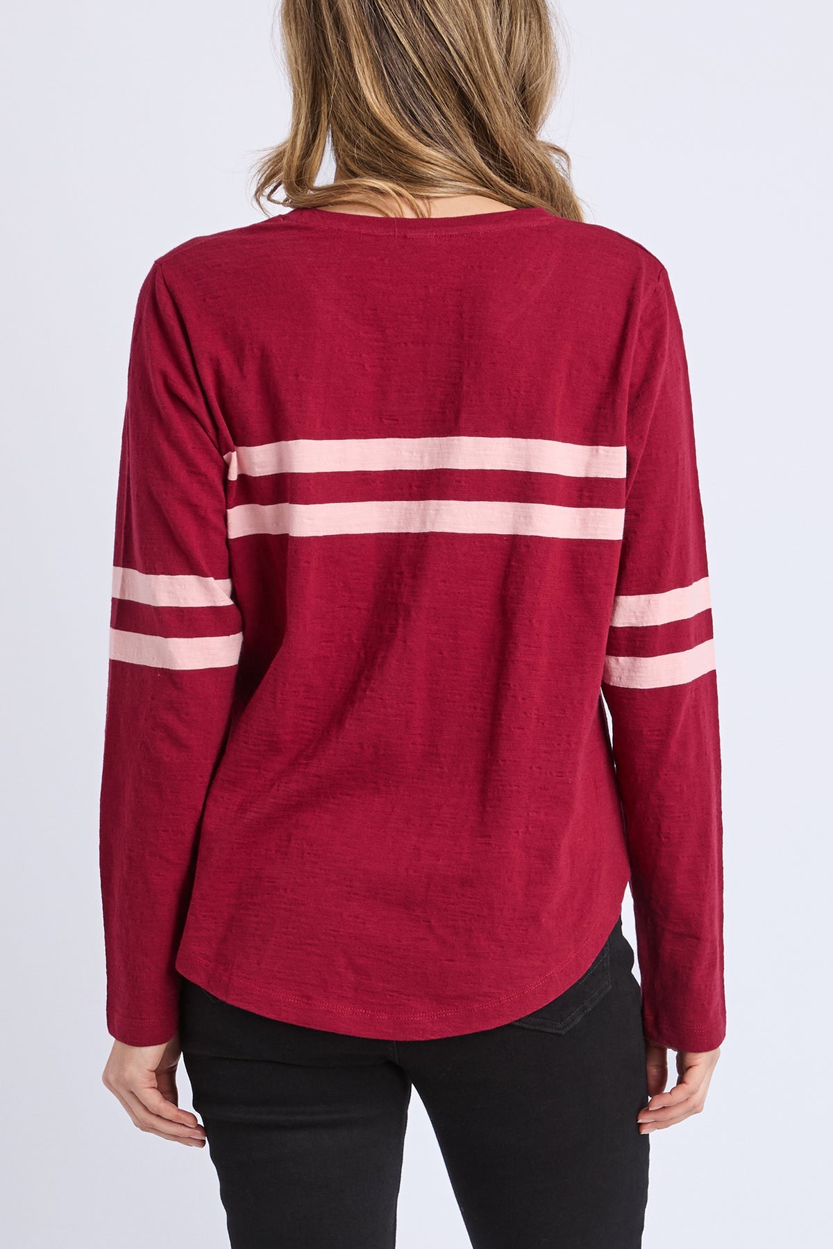 Red long-sleeve shirt with white stripes on a plain background