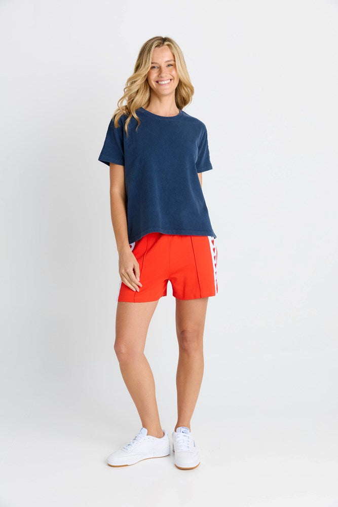Women in a short sleeve Navy Tee