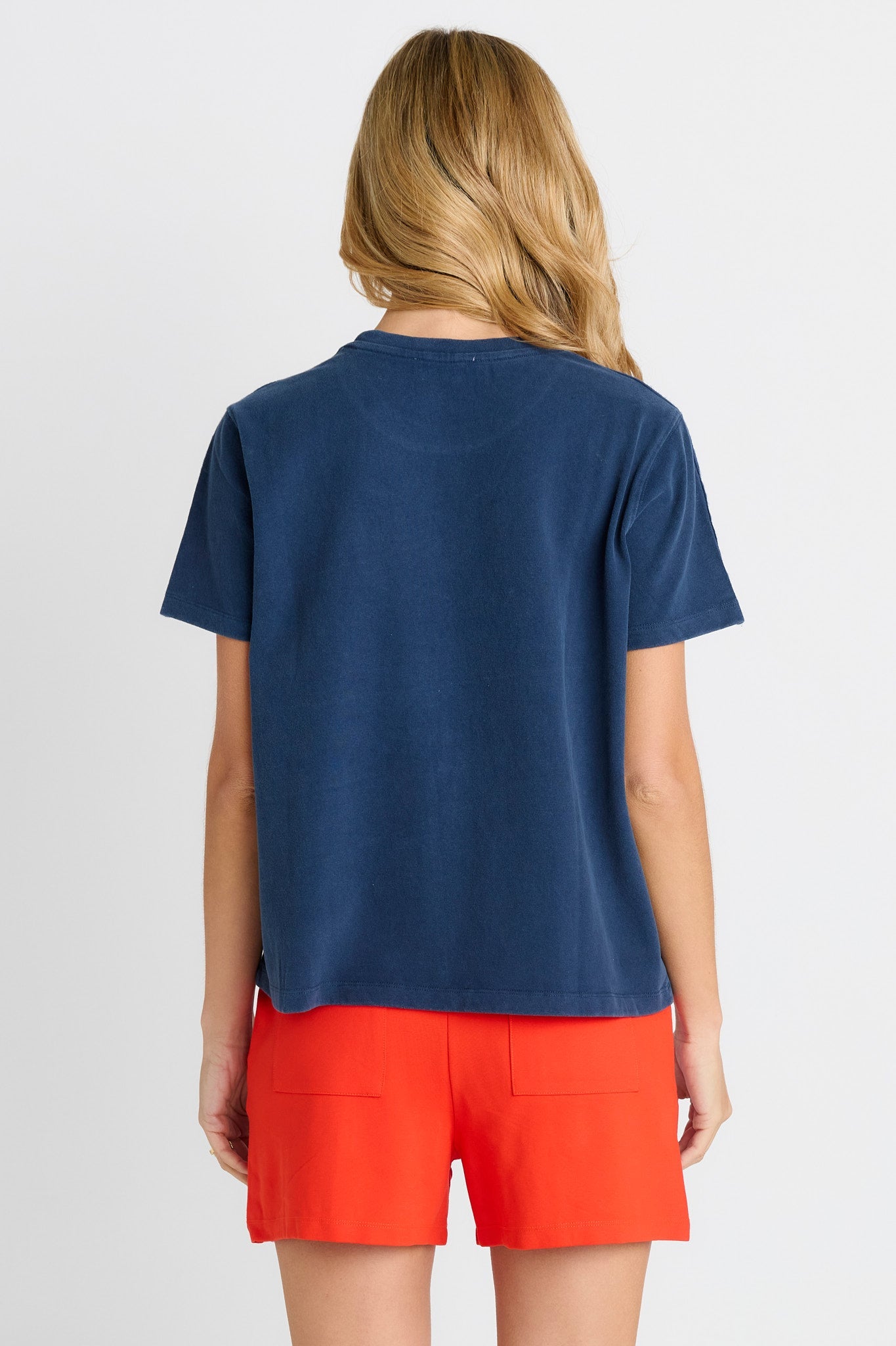 Women in a short sleeve Navy Tee