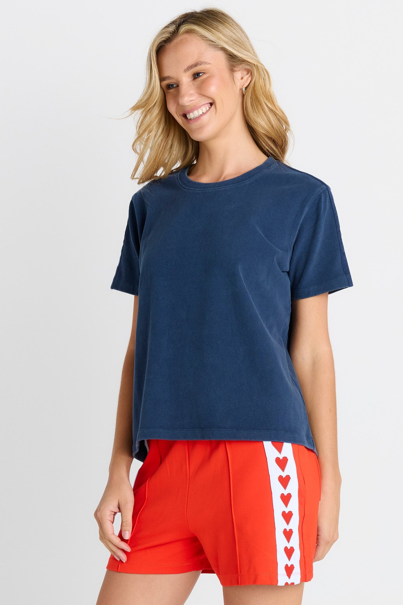 Women in a short sleeve Navy Tee