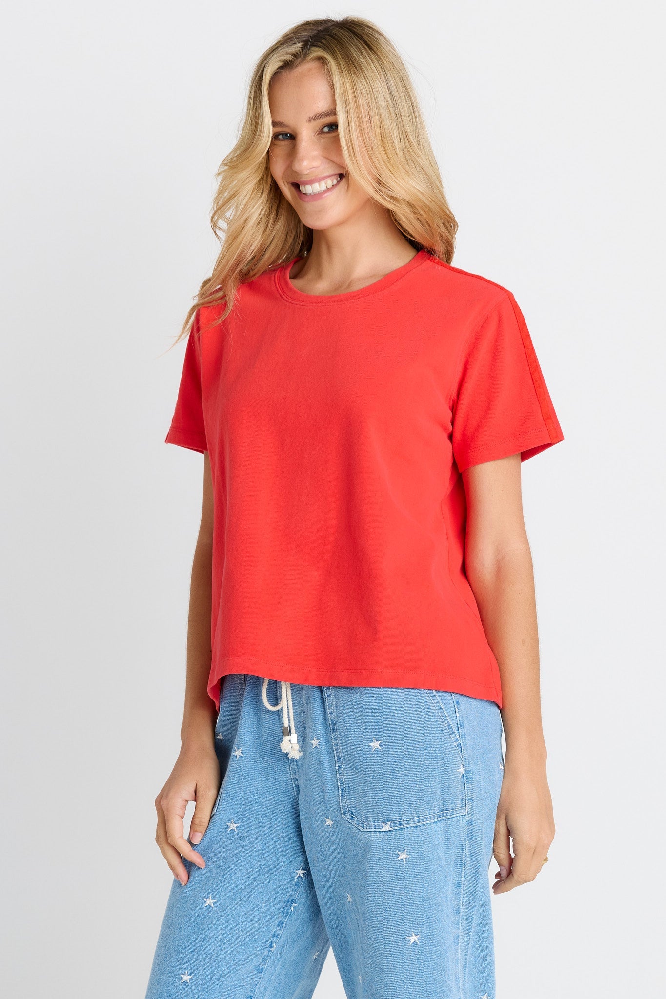 Woman in red short sleeve tee