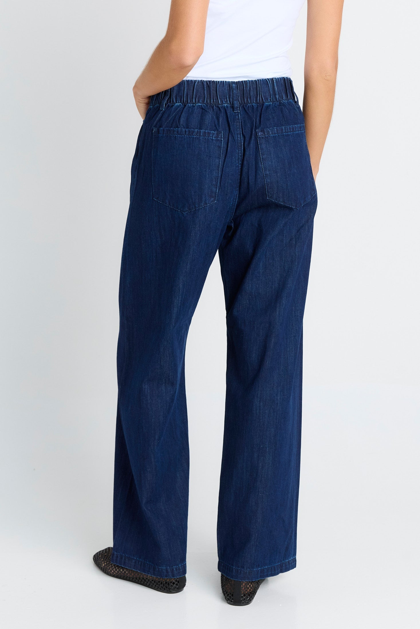 rear of women wearing navy jeans
