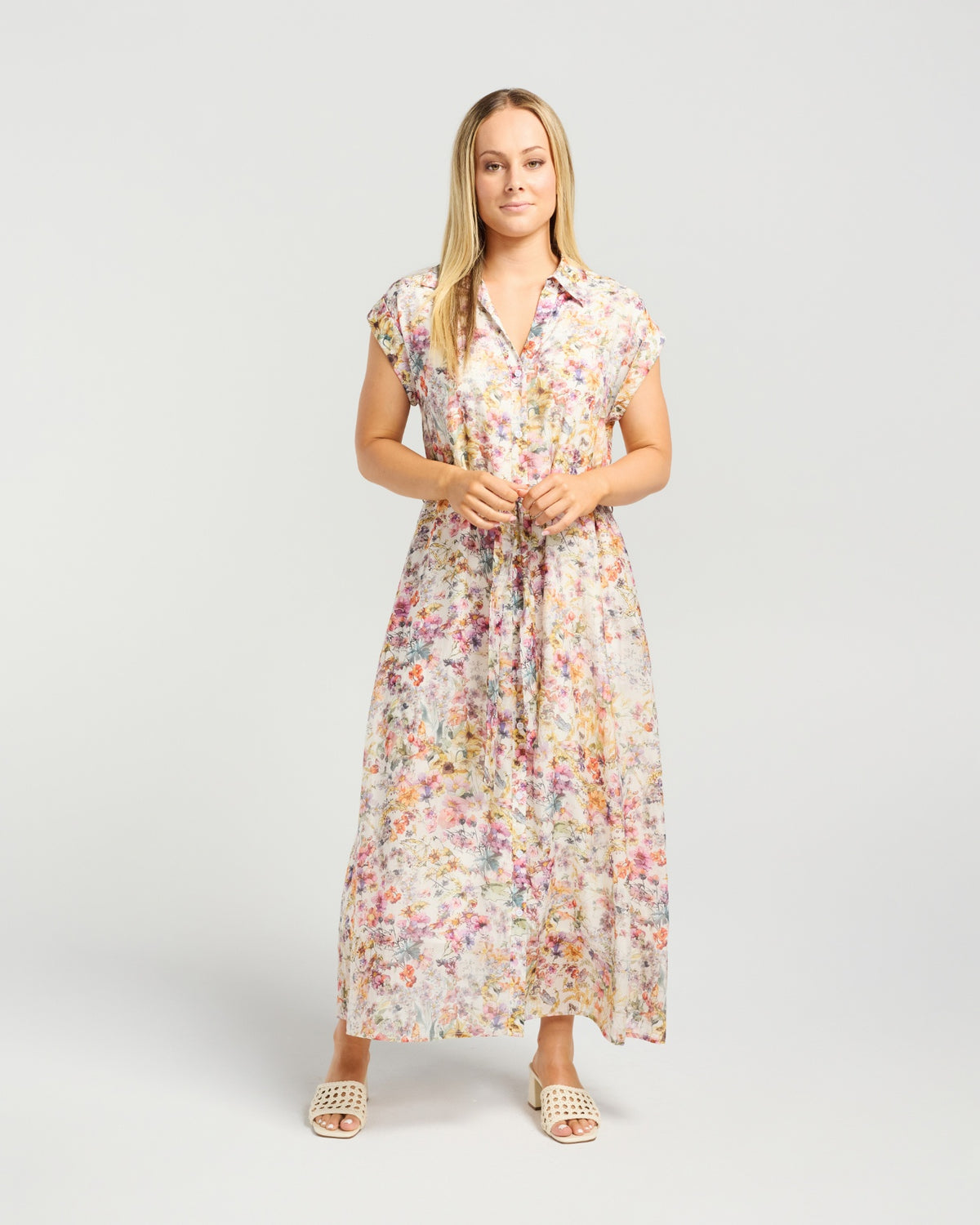 Woman wearing a floral dress on a white background