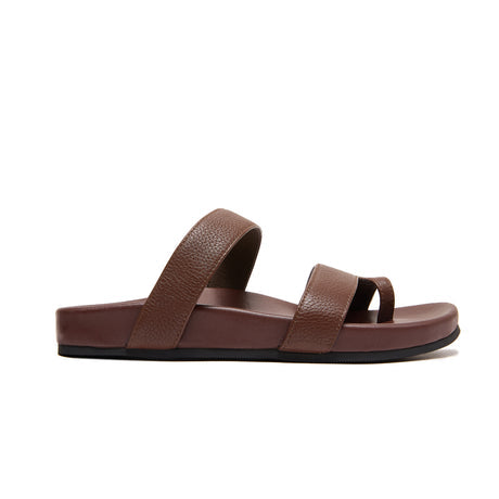 A single brown leather slide sandal with two textured straps, shown in a side profile on a solid white background.