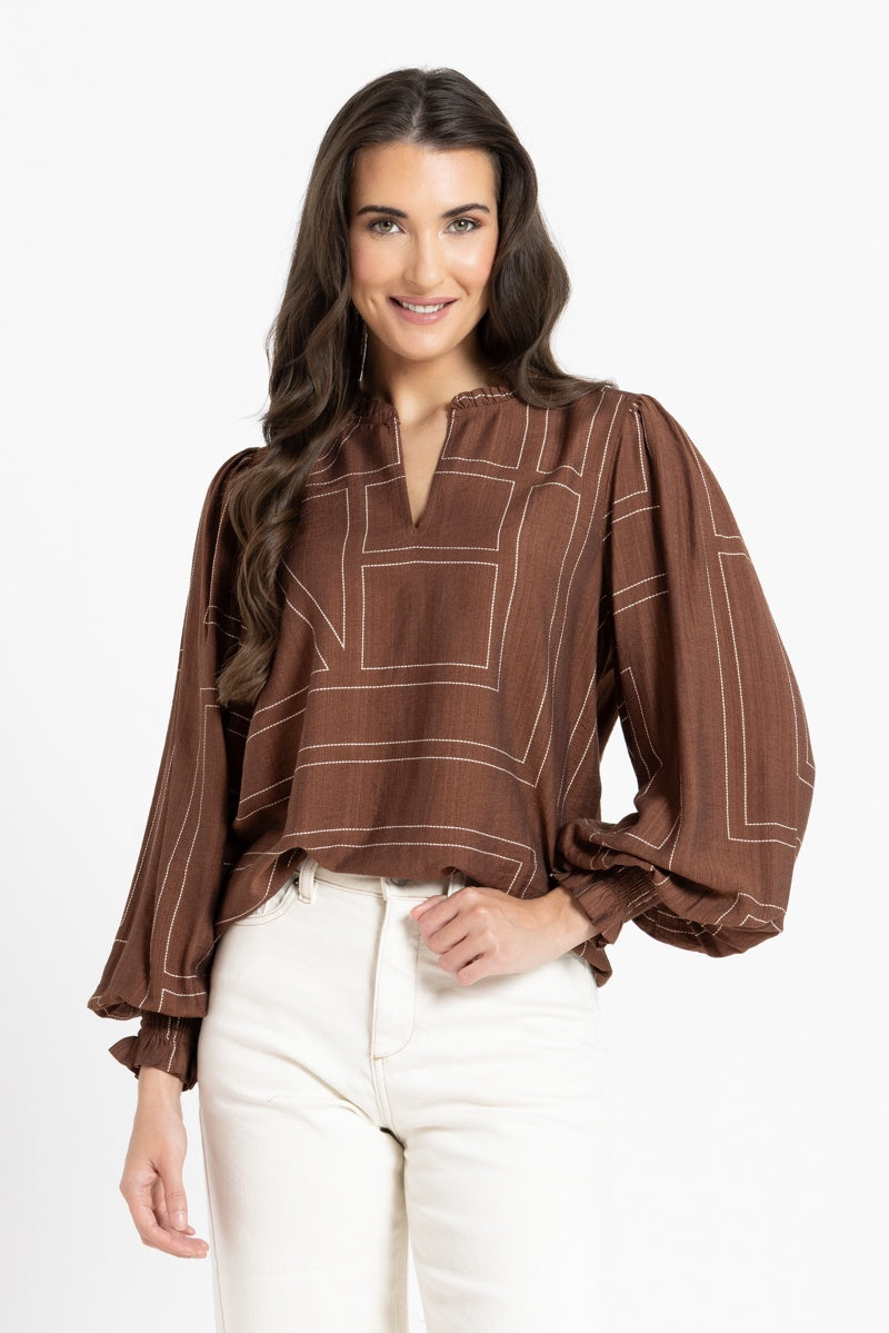 women in brown blouse