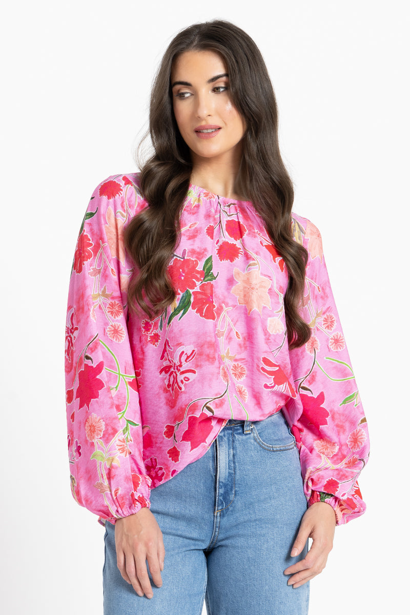 Women wearing a pink floral blouse