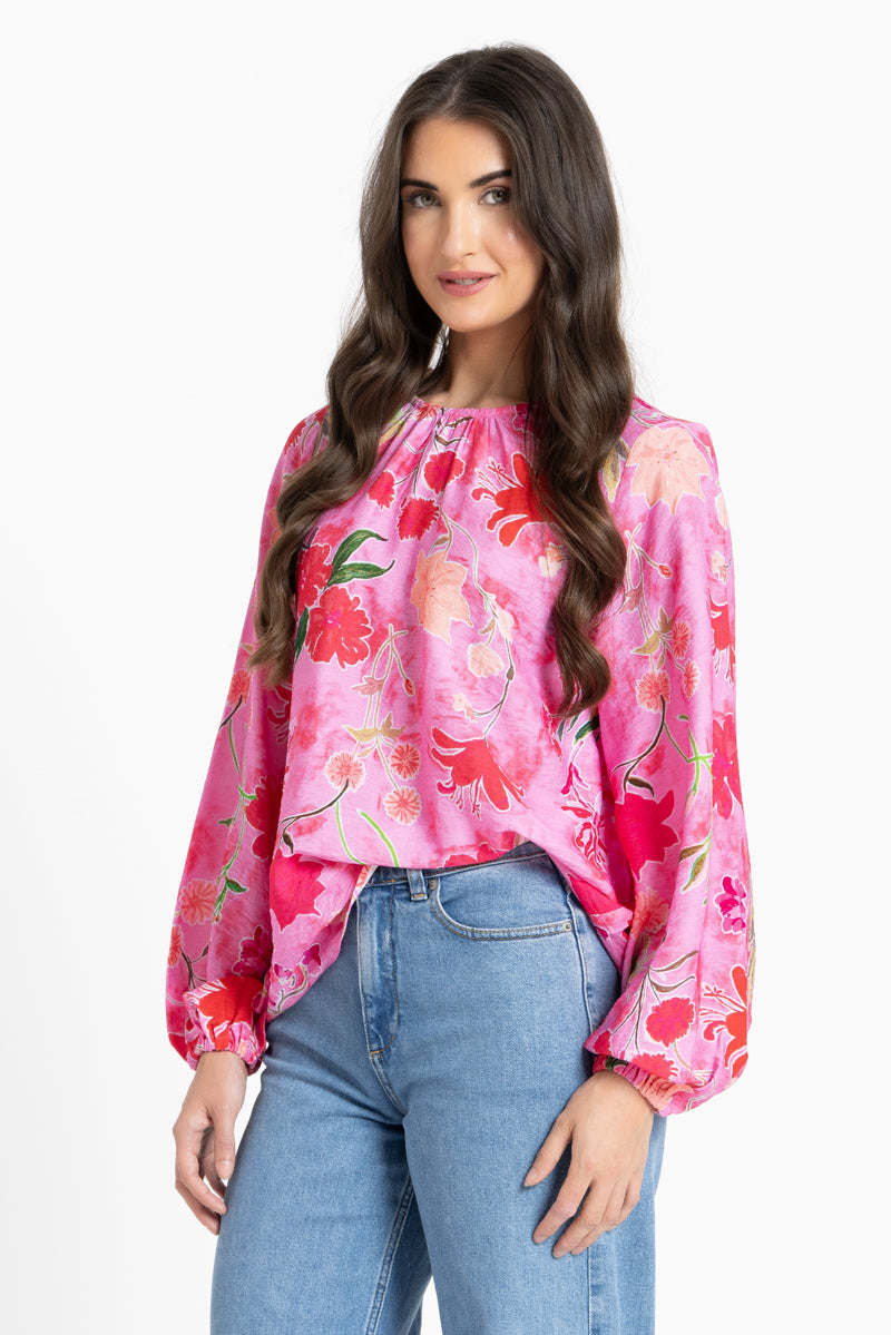 Women wearing a pink floral blouse