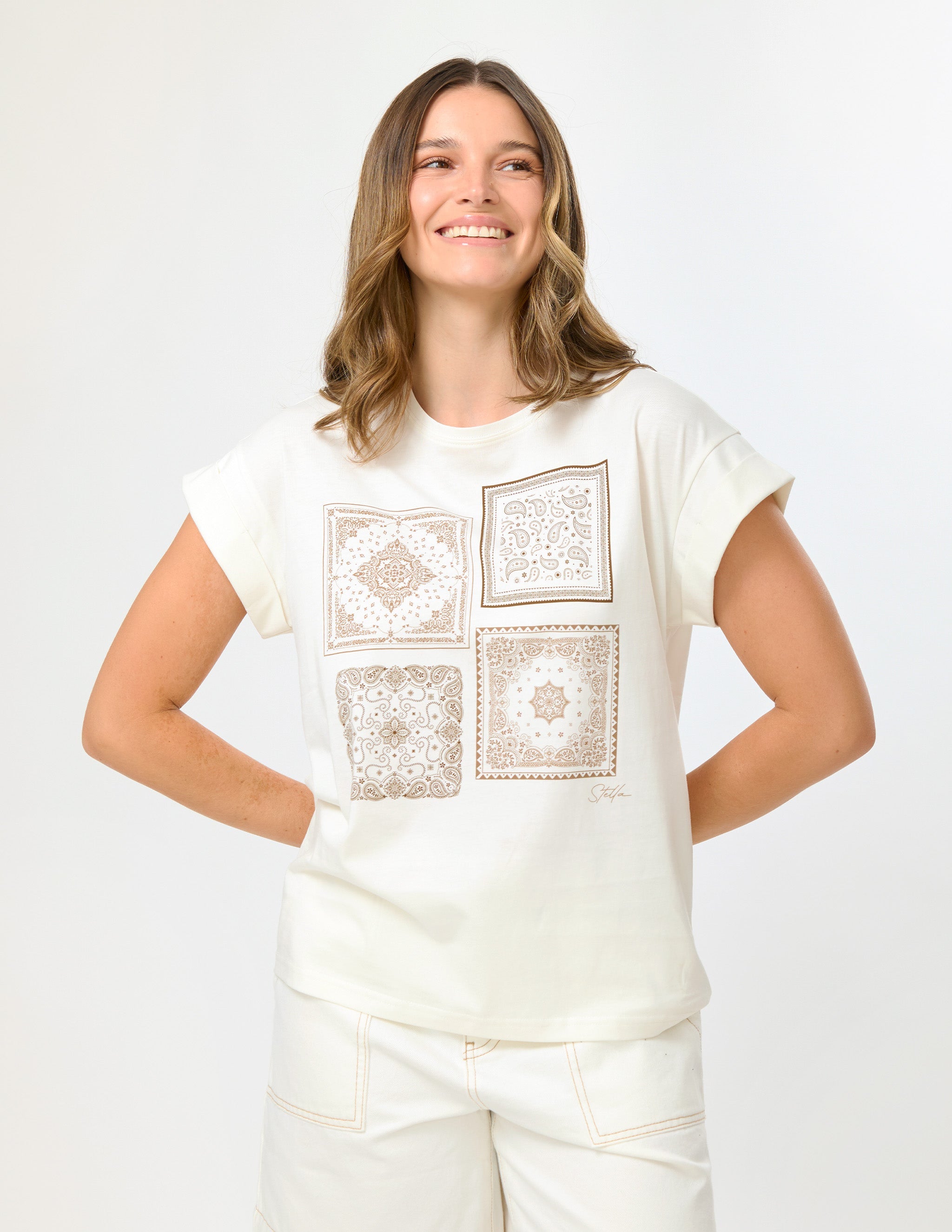 Women wearing a short sleeved t-shirt with a tile pattern printed on the front