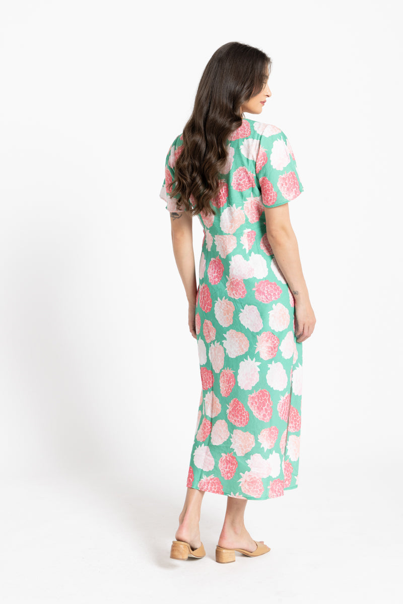 Rear of Women wearing a green dress