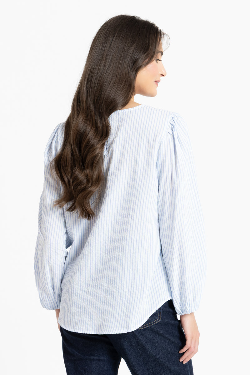 Back of Woman wearing a white and blue stripe blouse