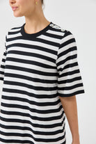 Black and white striped shirt worn by a person on a white background