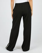 Black wide-leg pants worn by a person on a white background