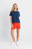 Women in a short sleeve Navy Tee
