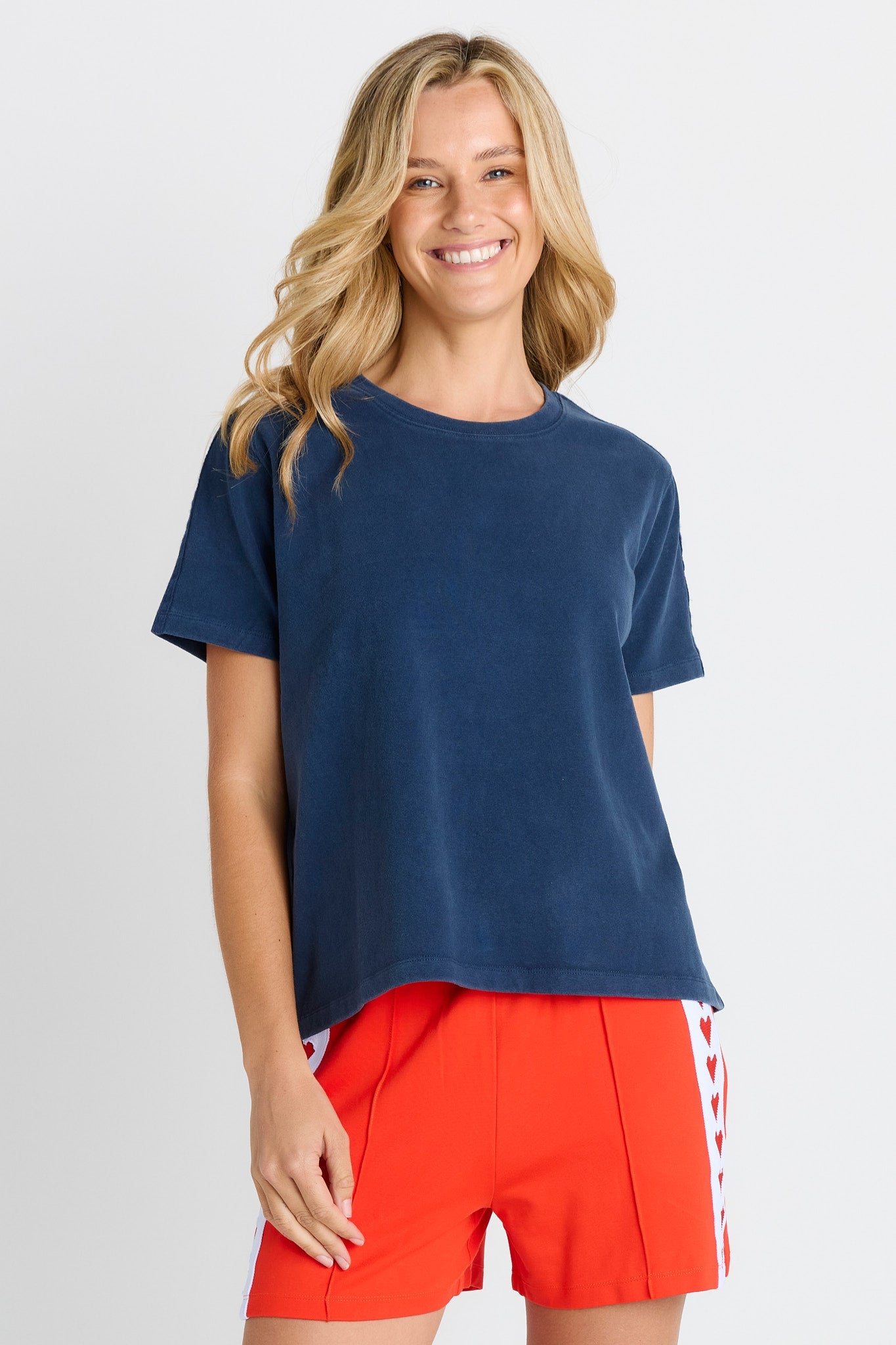 Women in a short sleeve Navy Tee