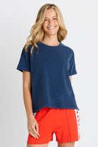 Women in a short sleeve Navy Tee
