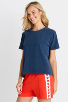 Women in a short sleeve Navy Tee