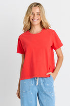 Woman in red short sleeve tee