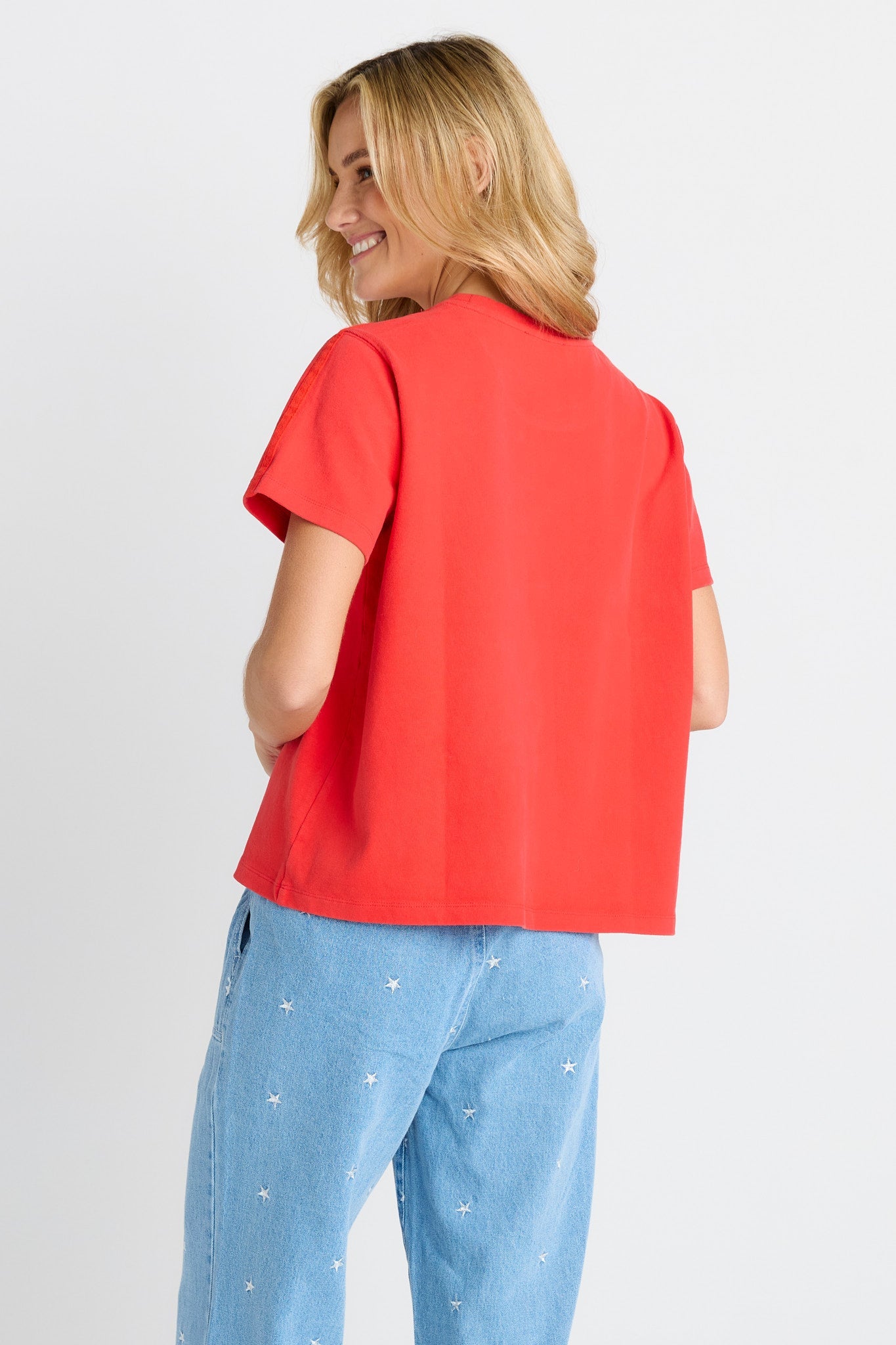 Woman in red short sleeve tee