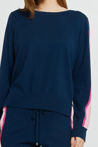 Navy blue sweater with pink stripes on a white background