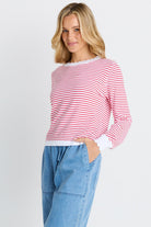 woman in white and red stripe sweater