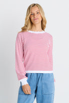woman in white and red stripe sweater