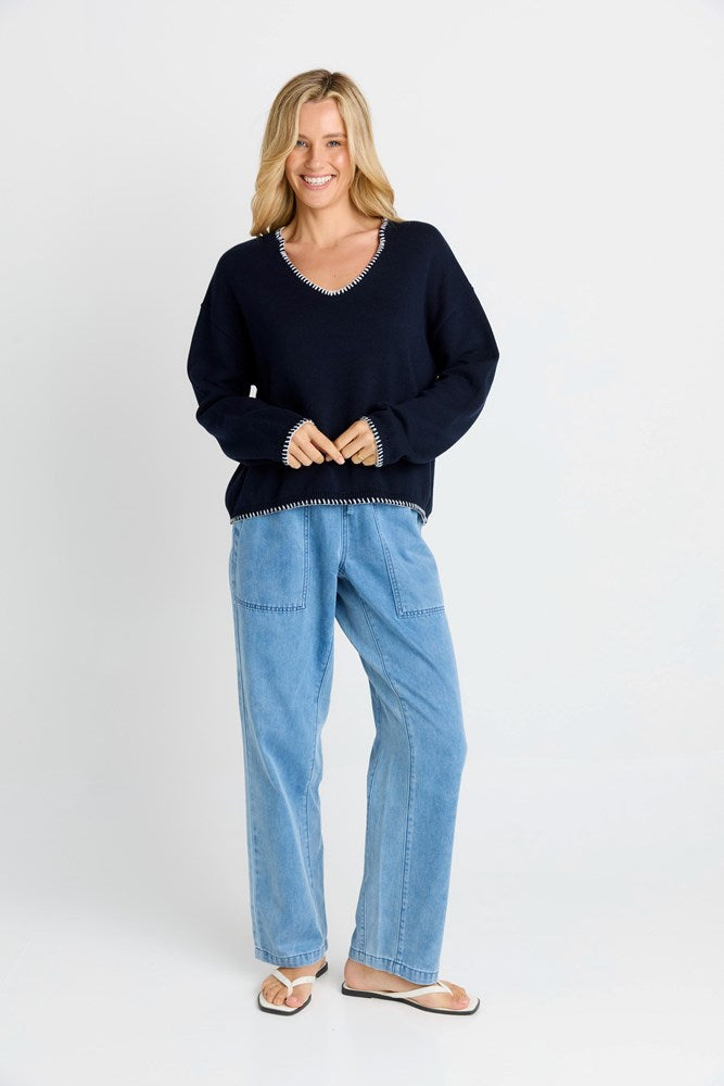 Women wearing navy sweater