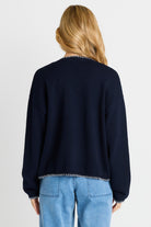 Rear of women wearing navy sweater