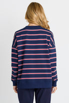 Rear of Women in a Navy and Red Stripe Sweatshirt