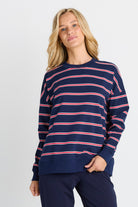 Women in a Navy and Red Stripe Sweatshirt