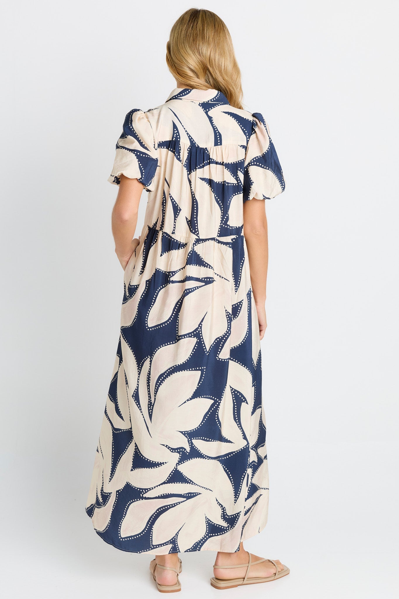 Women from behind in a navy floral print Shirt Dress