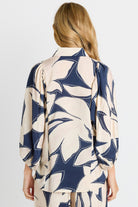 Rear of Woman wearing Navy & White Shirt