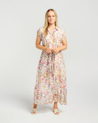 Woman wearing a floral dress on a white background