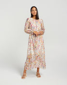 Woman wearing a floral dress on a white background