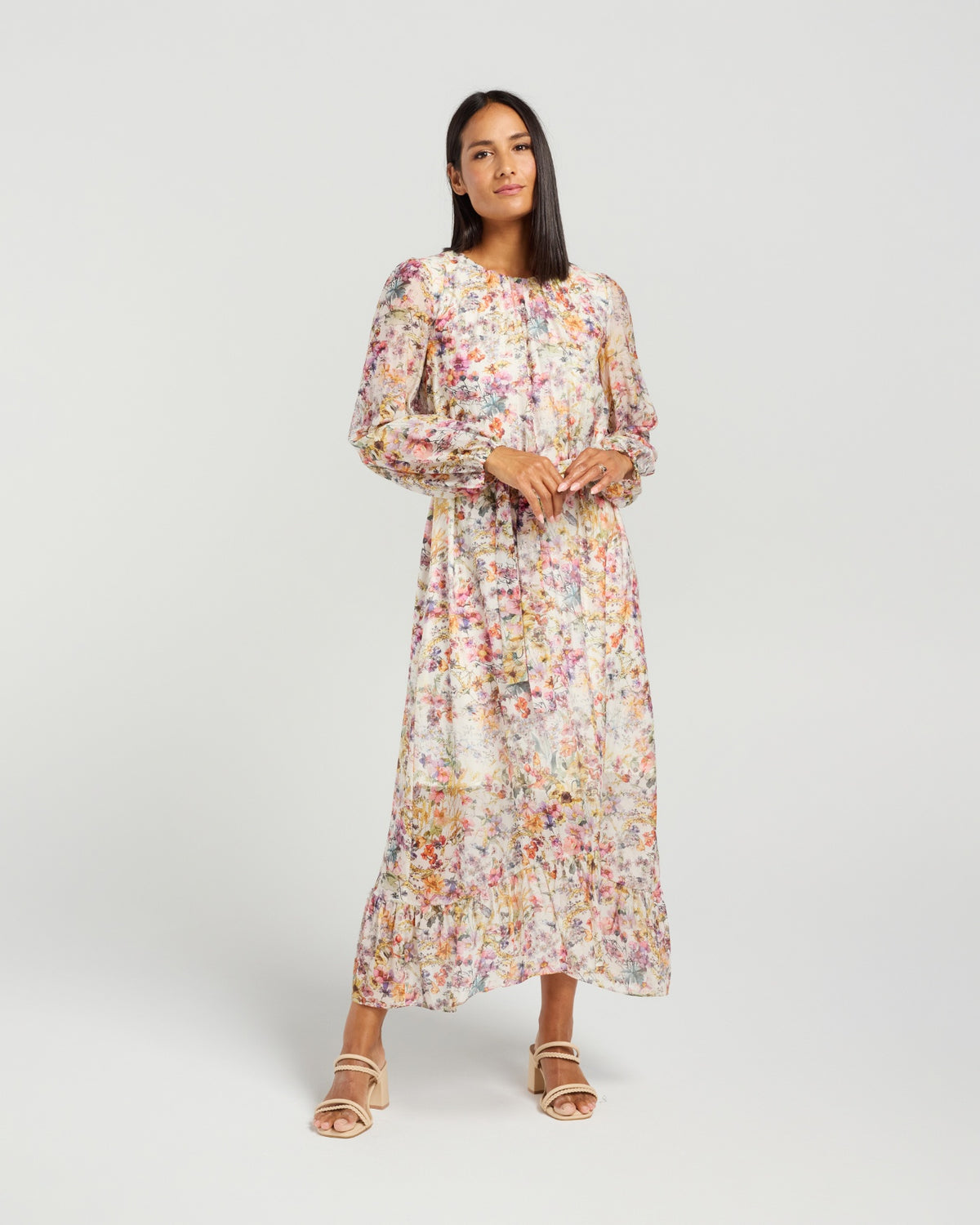 Woman wearing a floral dress on a white background