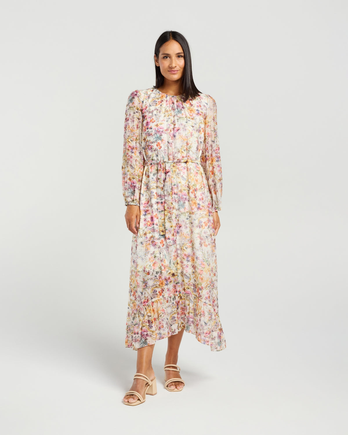 Woman wearing a floral dress on a white background