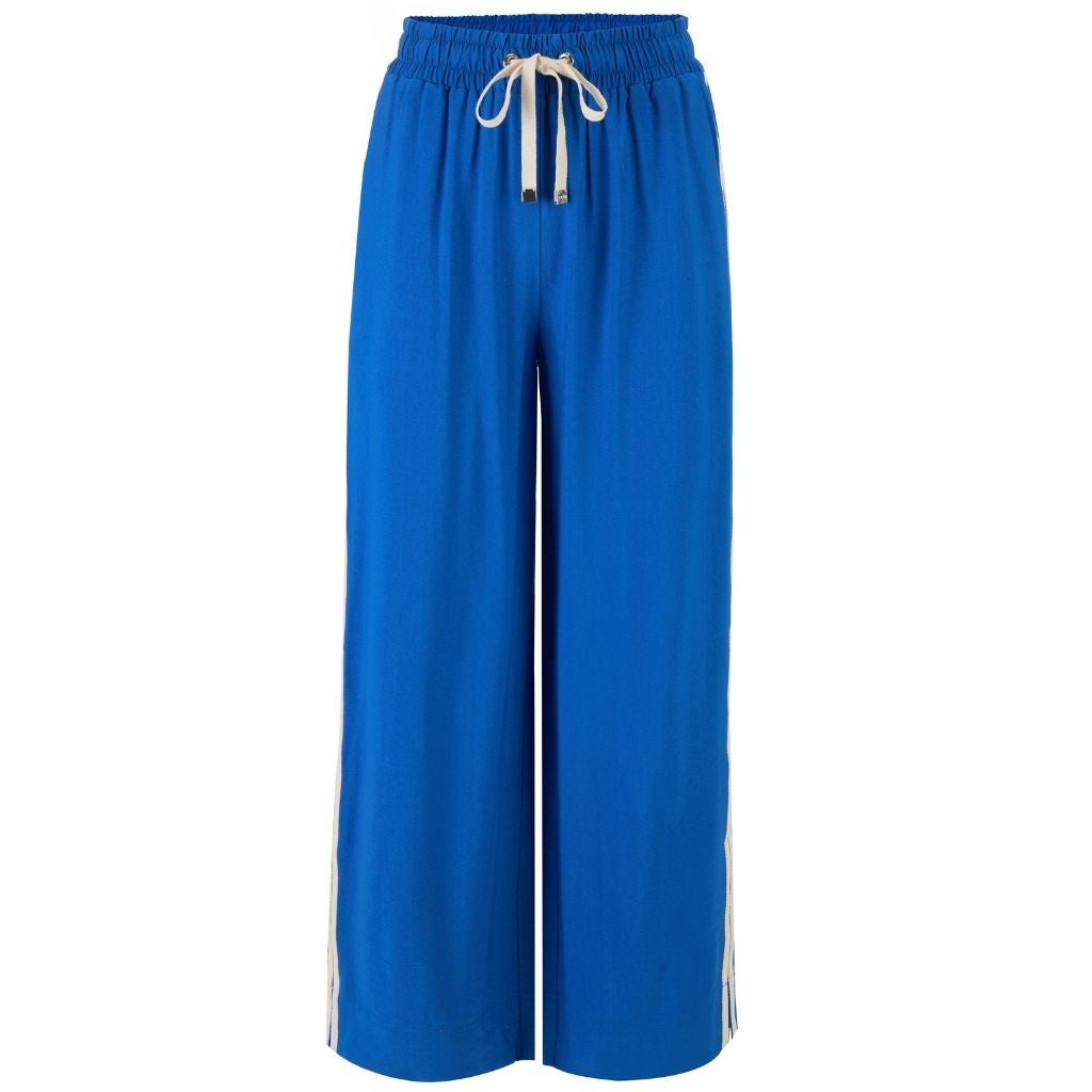 Bright blue wide-leg cropped pants with an elastic waistband, white drawstring, and white side stripes, shown on a plain white background.