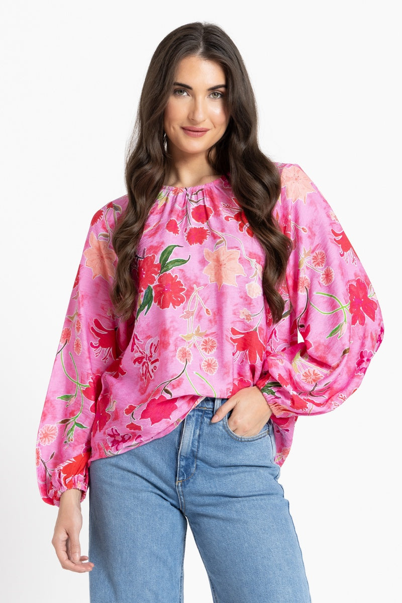 Women wearing a pink floral blouse