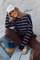 Women in a Navy and Red Stripe Sweatshirt