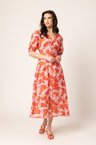 women wearing a red floral dress.