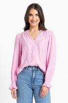 Woman wearing pink blouse