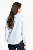 Back of Woman wearing a white and blue stripe blouse